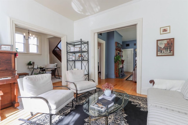 living room featuring a chandelier and hardwood / wood-style floors