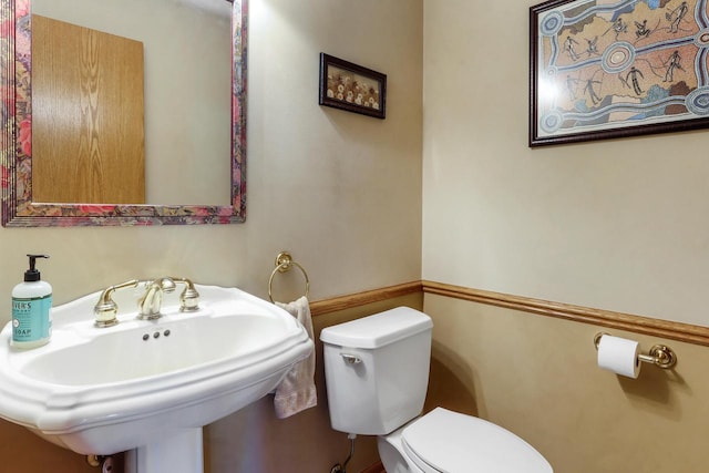 bathroom with toilet and sink