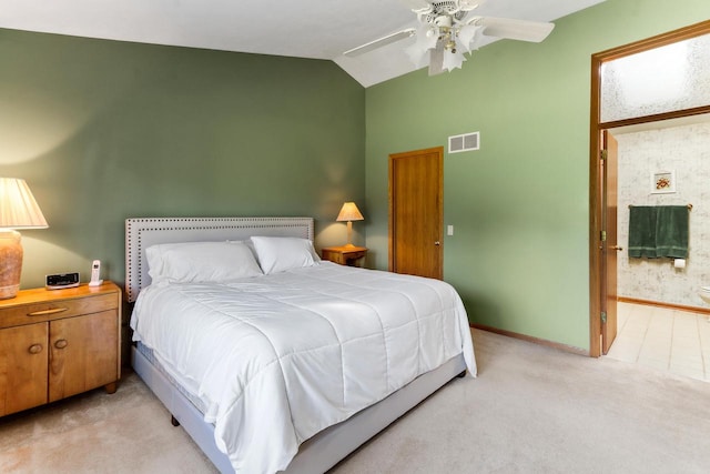 bedroom with ceiling fan, light carpet, and vaulted ceiling