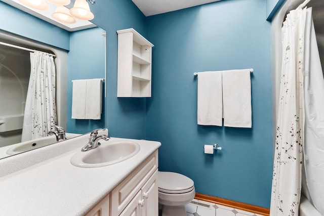 full bathroom featuring vanity, shower / tub combo, and toilet