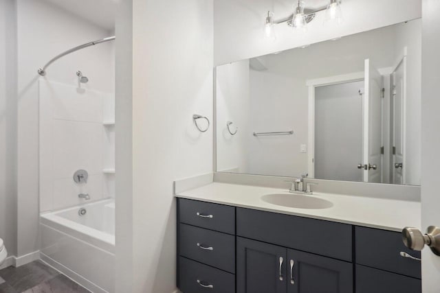 bathroom featuring shower / tub combination and vanity