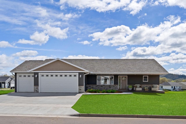 view of front of home with a garage and a front yard