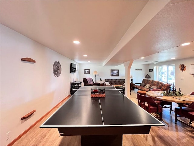 playroom with light hardwood / wood-style flooring