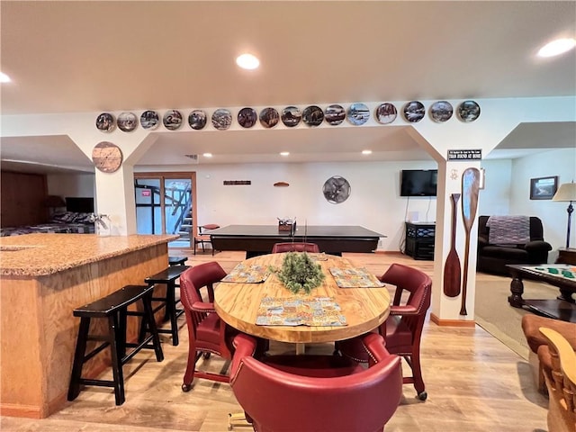 dining area with light hardwood / wood-style floors