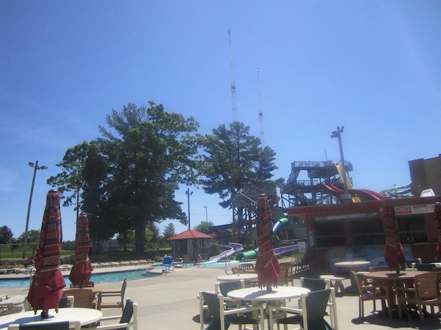 view of community featuring a patio area and a swimming pool