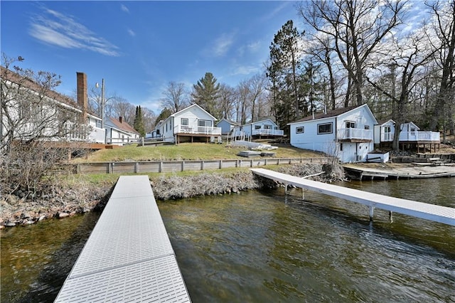 dock area with a deck with water view