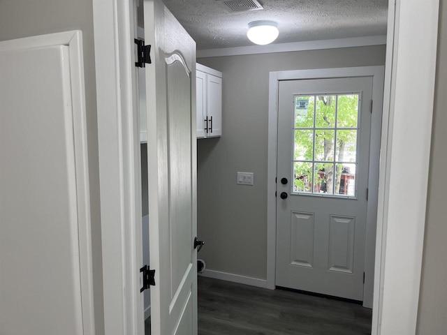 409 S Linden St, Adams, WI 53910 - doorway to outside featuring a textured ceiling and dark hardwood / wood-style floors