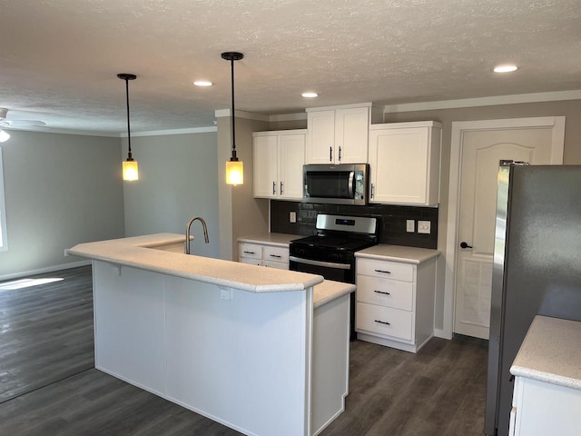 kitchen featuring appliances with stainless steel finishes, dark wood-type flooring, an island with sink, and backsplash