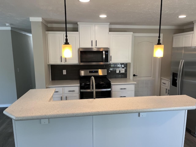 409 S Linden St, Adams, WI 53910 - kitchen with stainless steel appliances, white cabinetry, tasteful backsplash, and decorative light fixtures