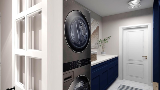 washroom featuring stacked washer and clothes dryer