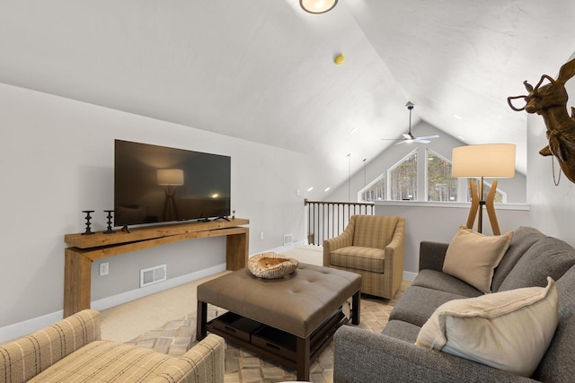 carpeted living room featuring ceiling fan and lofted ceiling