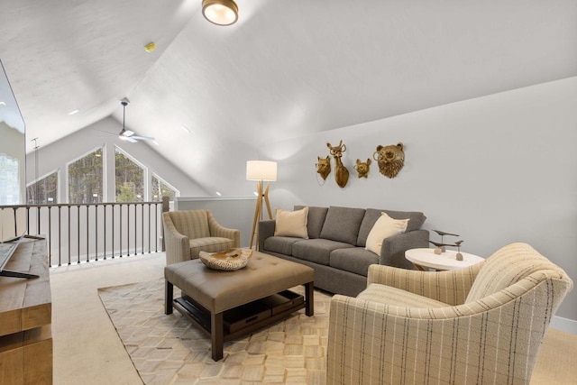 living room with ceiling fan and lofted ceiling