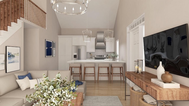 living room with a notable chandelier, sink, high vaulted ceiling, and light hardwood / wood-style flooring