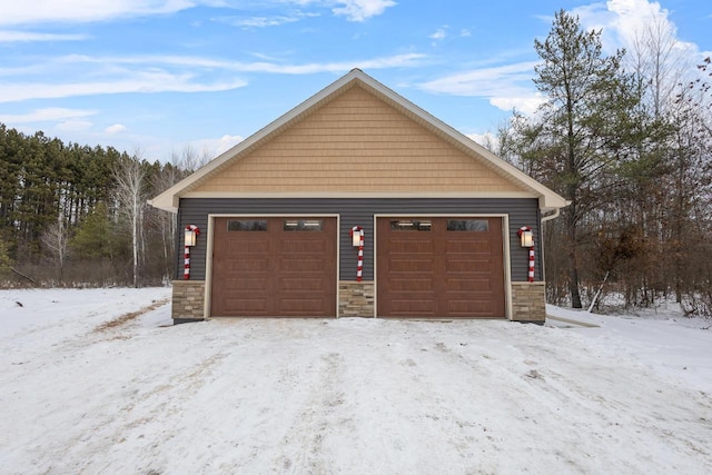 view of snow covered garage