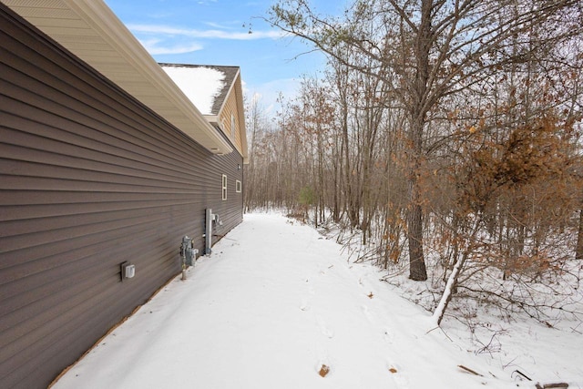 view of yard layered in snow