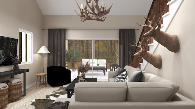 living room featuring a wealth of natural light, a chandelier, and vaulted ceiling