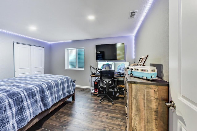 bedroom featuring a closet and dark hardwood / wood-style floors