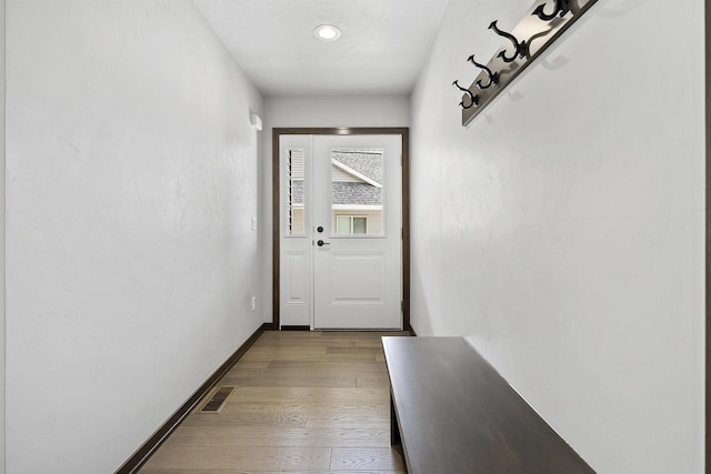 entryway with light hardwood / wood-style floors