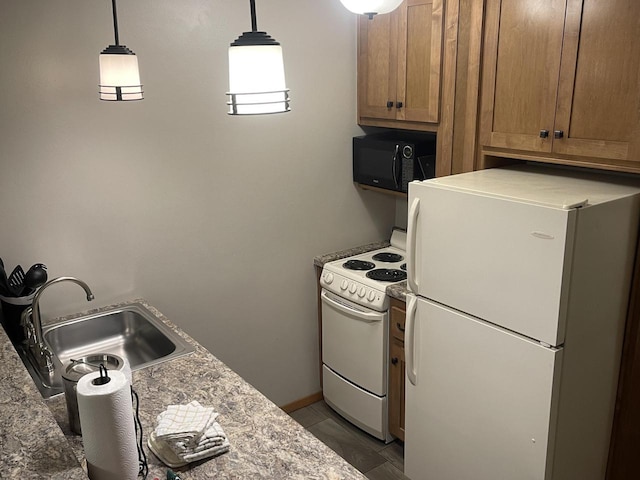 kitchen with tile flooring, decorative light fixtures, white appliances, and sink