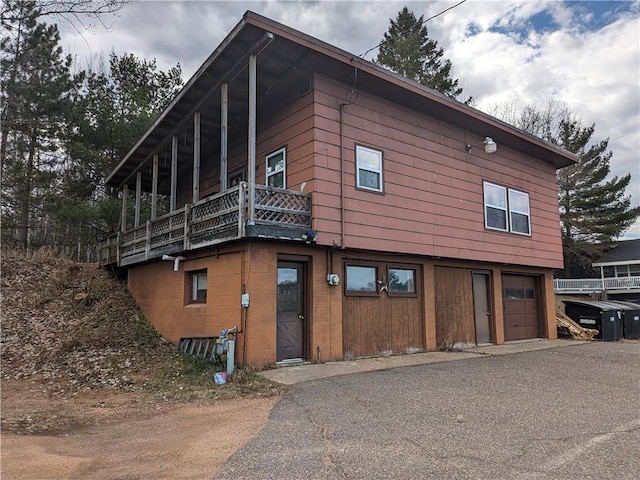 view of side of property featuring a balcony