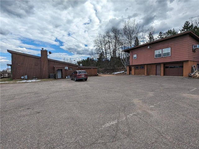 view of side of home with a garage