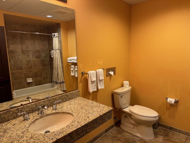 full bathroom with shower / bath combo with shower curtain, vanity, toilet, and tile floors