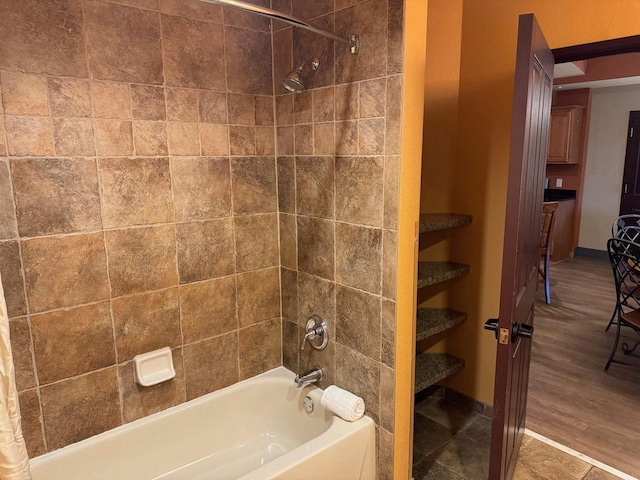 bathroom featuring hardwood / wood-style floors and shower / bath combo with shower curtain