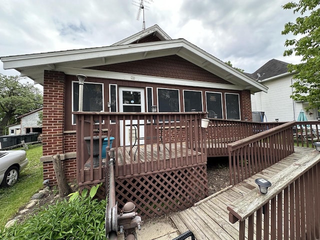 back of house featuring a deck