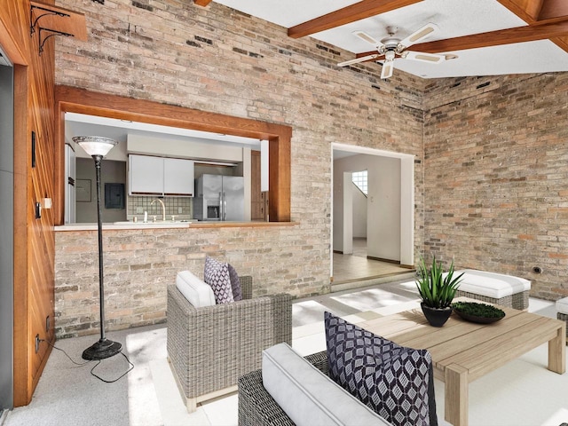 view of patio with ceiling fan and sink