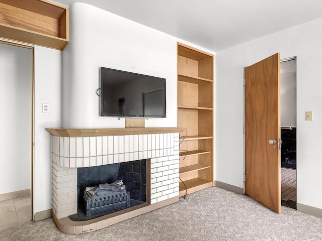 1608 N Rapids Rd, Manitowoc, WI 54220 - unfurnished living room featuring a fireplace, baseboards, and carpet flooring