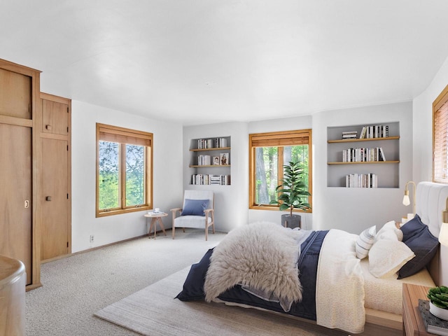 bedroom featuring light carpet