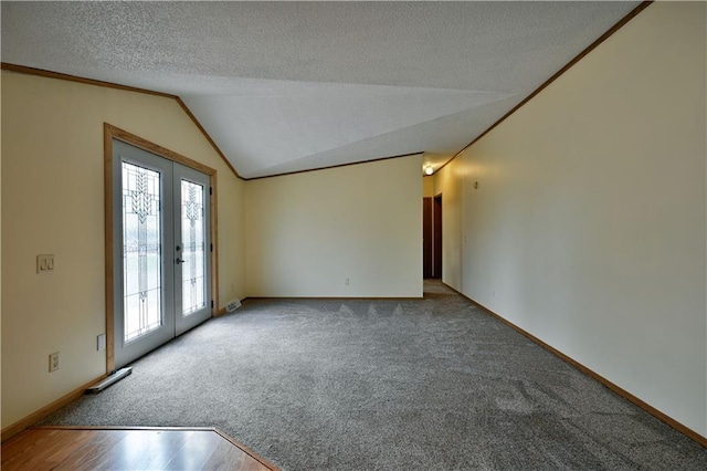 carpeted empty room with crown molding, a healthy amount of sunlight, vaulted ceiling, and a textured ceiling