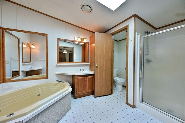 full bathroom with tile flooring, separate shower and tub, toilet, and vanity with extensive cabinet space