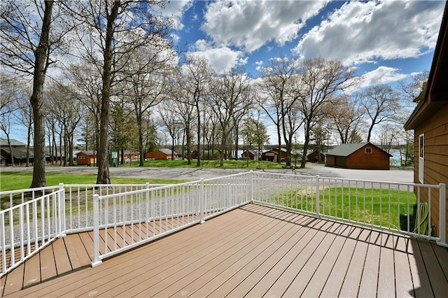 wooden deck with a lawn