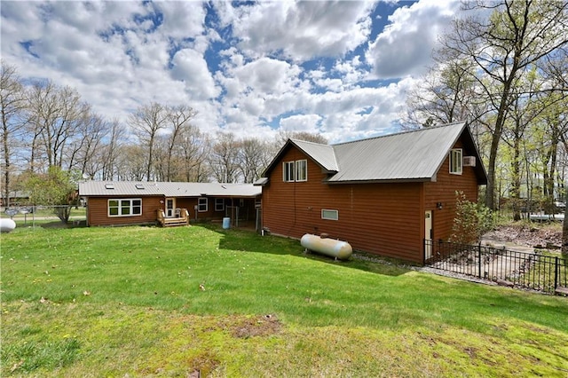 back of house featuring a lawn