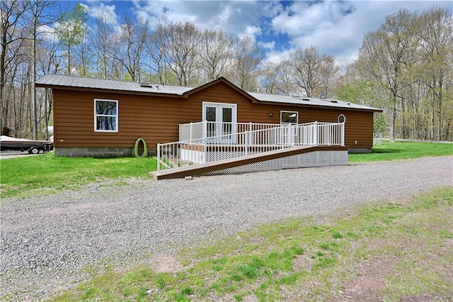 view of front of property with a wooden deck