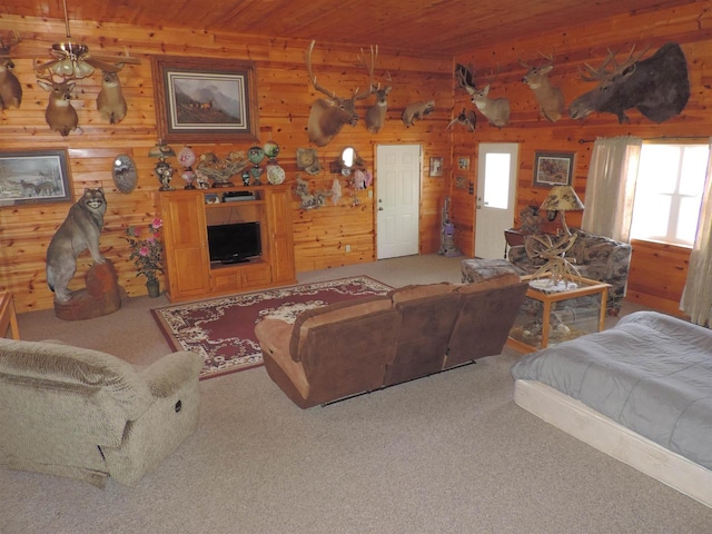 carpeted living room featuring wooden ceiling and wood walls