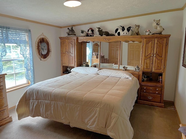 bedroom with a textured ceiling and carpet floors