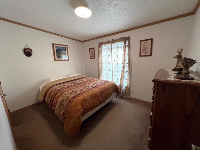 bedroom with a textured ceiling and carpet floors