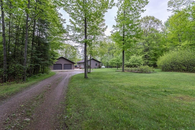 view of yard featuring a garage