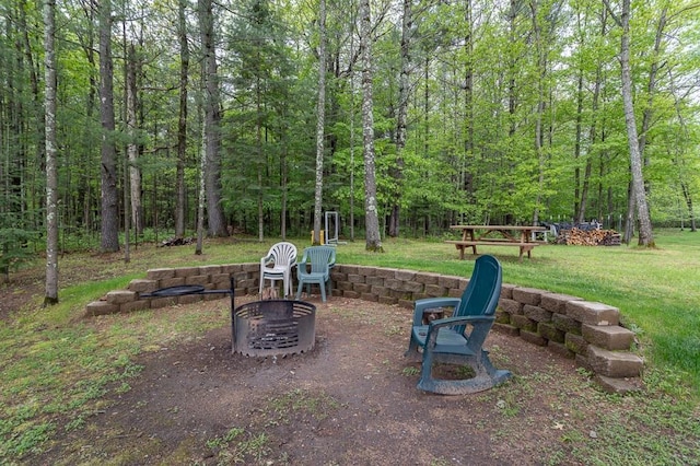 view of yard with an outdoor fire pit