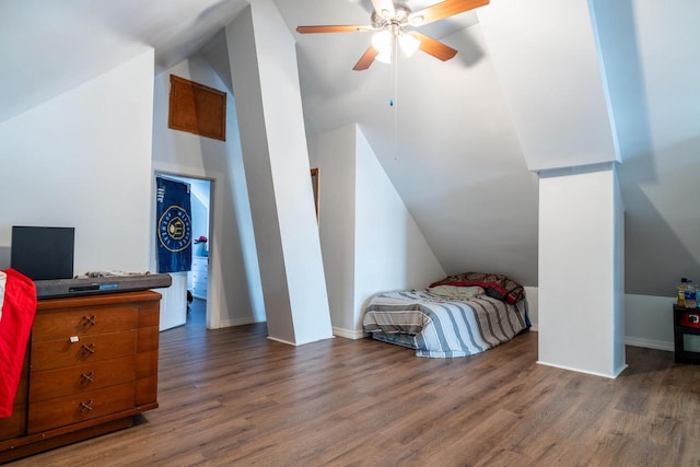 bedroom with dark hardwood / wood-style floors, ceiling fan, and lofted ceiling