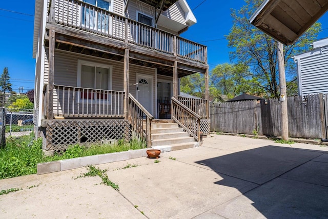 doorway to property featuring a balcony