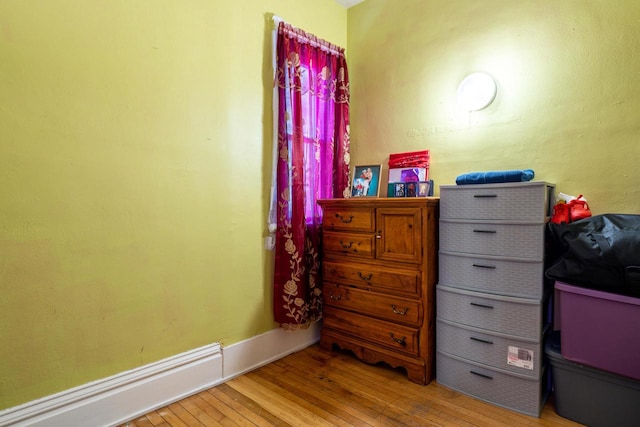 interior space with baseboard heating and wood-type flooring