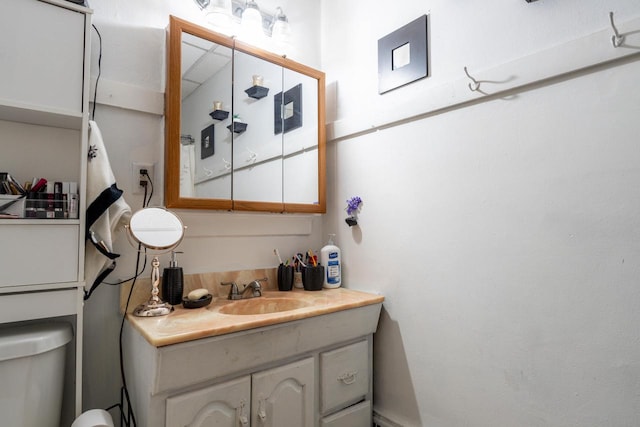 bathroom featuring toilet and oversized vanity