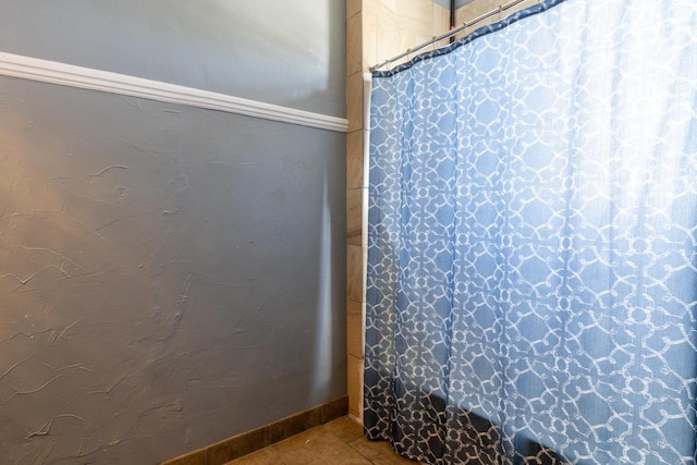 bathroom with tile flooring