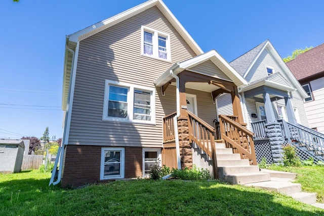 view of front facade with a front yard and a porch