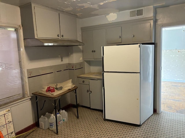 kitchen featuring white fridge