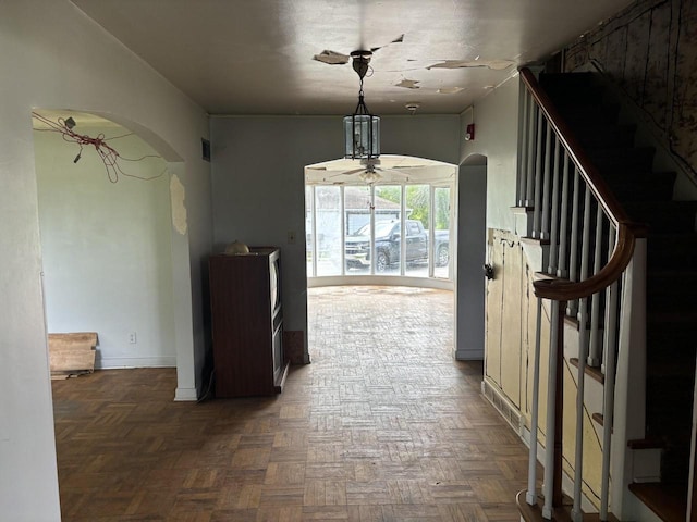 hallway featuring dark parquet flooring