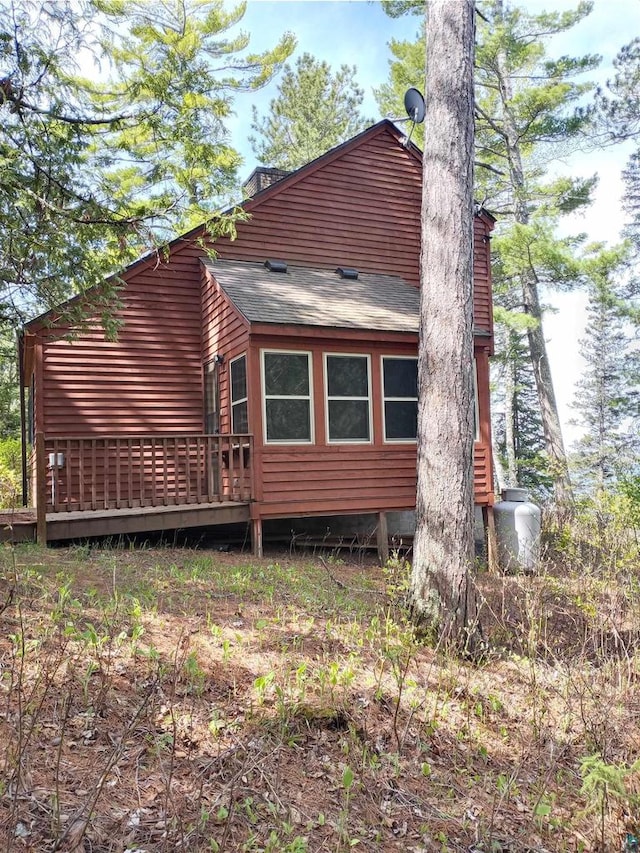 view of property exterior featuring a deck